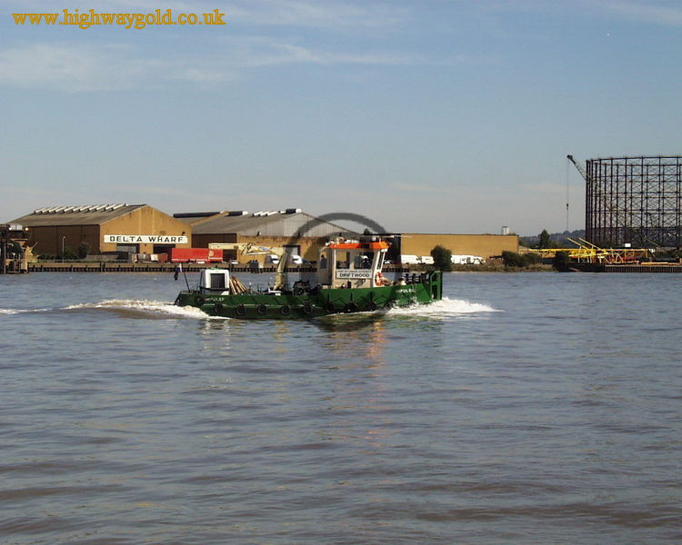 Barge passing Delta Wharf