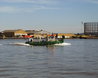 Barge passing Delta Wharf